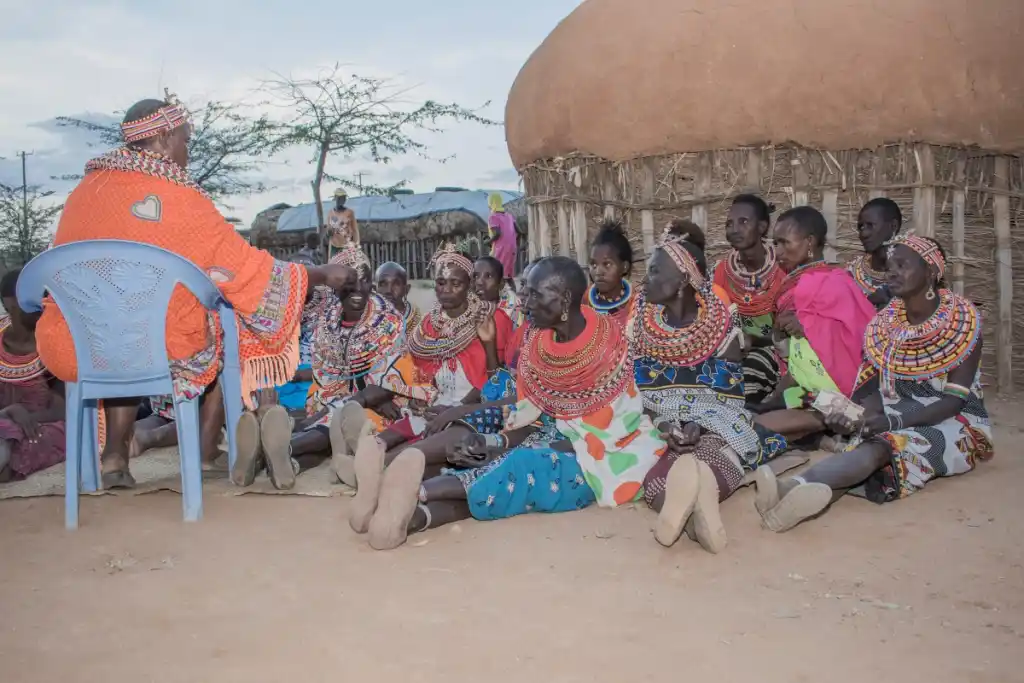 Umoja women gathering for village assembly under the 'tree of speech' in Kenya - Porcupine Tours