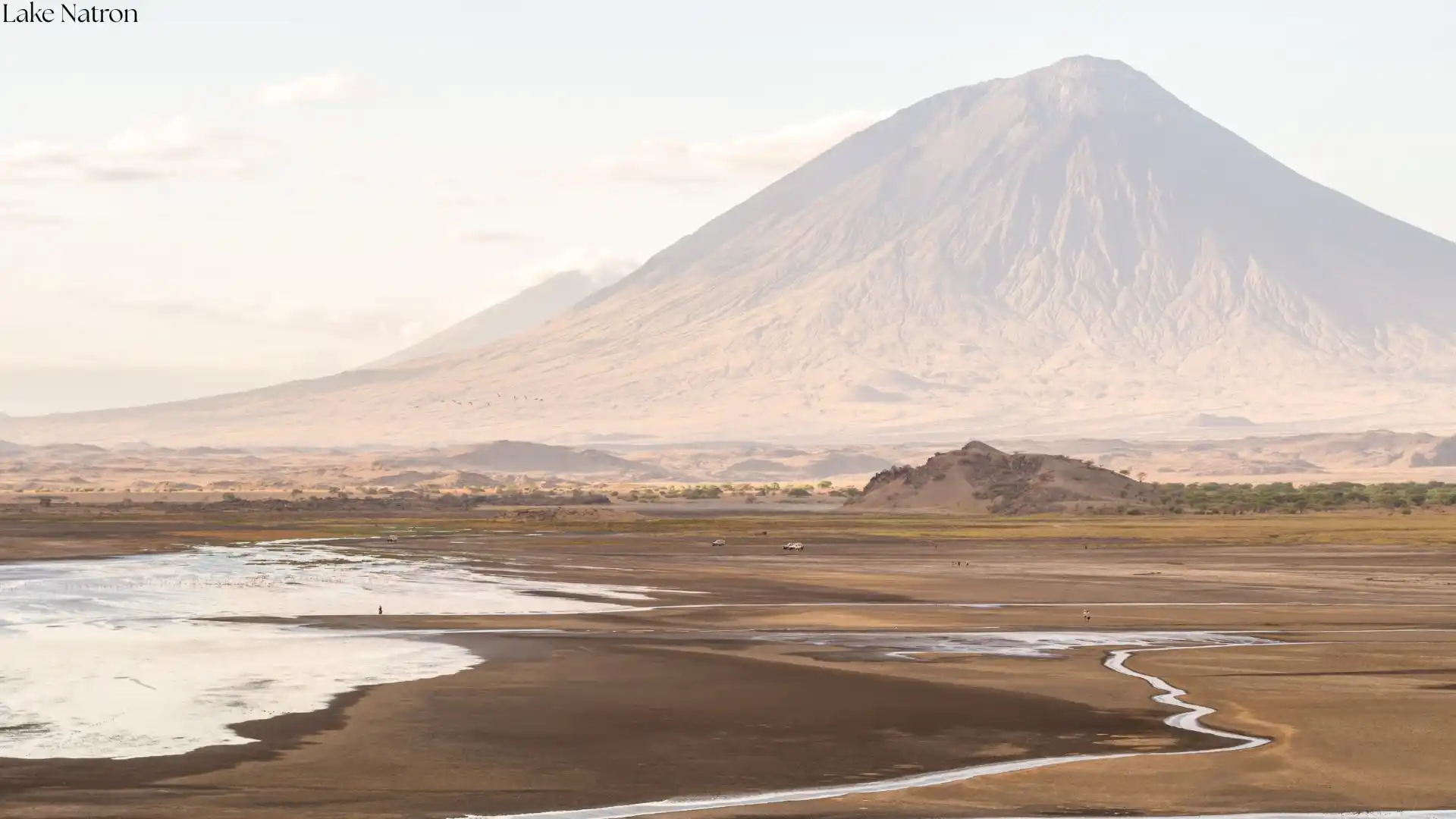 Ol Doinyo Lengai active volcano towering over Lake Natron - Mountain of God in Tanzania